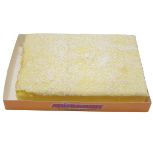 MINI LEMON SPONGE SLAB – light lemon sponge topped with lemon fondant icing and coconut